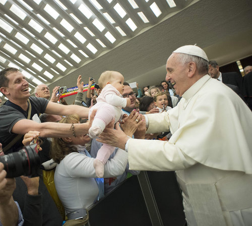 Above, Pope Francis embraces a baby on April 30 at the Vatican; below, Pope Francis greets a family at Our Lady of the Assumption Cathedral in Santiago de Cuba, Sept. 22.
Above, Pope Francis embraces a baby on April 30 at the Vatican; below, Pope Francis greets a family at Our Lady of the Assumption Cathedral in Santiago de Cuba, Sept. 22.