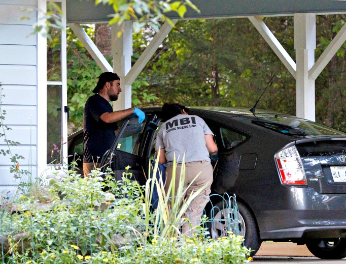 Two Mississippi Bureau of Investigation agents inspect a car in the garage of the Durant, Miss., home of two slain Catholic nuns who worked as nurses at the Lexington Medical Clinic, Aug. 25. The clinic office manager and a Durant police officer discovered their bodies inside the house after both nuns did not report for work. Authorities said their were signs of a break-in and their vehicle was missing.
Two Mississippi Bureau of Investigation agents inspect a car in the garage of the Durant, Miss., home of two slain Catholic nuns who worked as nurses at the Lexington Medical Clinic, Aug. 25. The clinic office manager and a Durant police officer discovered their bodies inside the house after both nuns did not report for work. Authorities said their were signs of a break-in and their vehicle was missing.