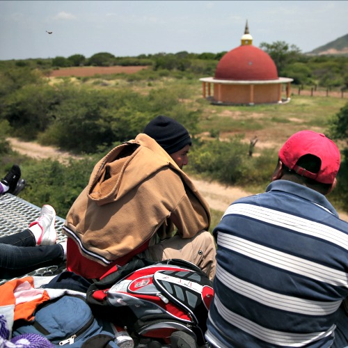 Central American immigrants ride atop a freight train to Ixtepec, Mexico, on their way to the United States.
Central American immigrants ride atop a freight train to Ixtepec, Mexico, on their way to the United States.