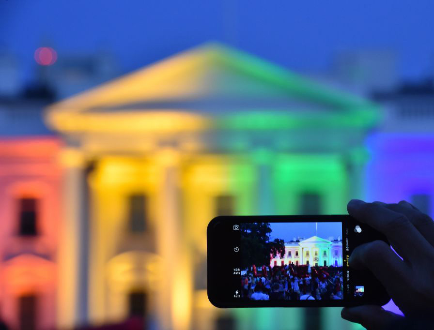 A PICTURE THAT DEFINES A DECADE. A person uses a smartphone to take a photo of the White House lit in rainbow colors, June 26, 2015, following the U.S. Supreme Court’s Obergefell decision mandating same-sex marriage nationwide. A PICTURE THAT DEFINES A DECADE. A person uses a smartphone to take a photo of the White House lit in rainbow colors, June 26, 2015, following the U.S. Supreme Court’s Obergefell decision mandating same-sex marriage nationwide.