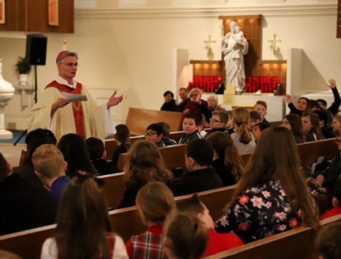 Bishop Thomas Daly shares the faith with students at recent Catholic Schools Week Mass. Bishop Thomas Daly shares the faith with students at recent Catholic Schools Week Mass.