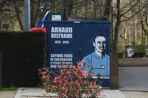 A street art work by artist '7 Nuit' pays tribute to the late Lt. Col. Arnaud Beltrame, as seen March 29 in Port Marly, a suburb of Paris. Beltrame is a heroic officer who was killed after he offered his life in exchange of a hostage in a terrorist attack. A street art work by artist '7 Nuit' pays tribute to the late Lt. Col. Arnaud Beltrame, as seen March 29 in Port Marly, a suburb of Paris. Beltrame is a heroic officer who was killed after he offered his life in exchange of a hostage in a terrorist attack.