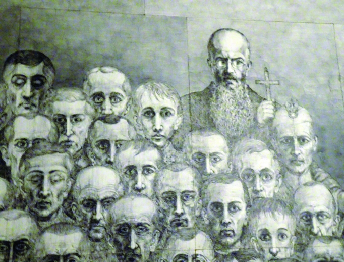 Polish Catholic artist Marian Kołodziej, who survived imprisonment in Auschwitz, created art that showcases the horrors he and millions of others, including St. Maximilian Kolbe, endured at the hands of the Nazis. His artwork is featured by the Franciscans in Harmeze, Poland; the grounds also include Kołodziej’s statues of St. Maximilian and the Blessed Mother. Franciscan Father Piotr Cuber (shown) explains the exhibit to visitors. Polish Catholic artist Marian Kołodziej, who survived imprisonment in Auschwitz, created art that showcases the horrors he and millions of others, including St. Maximilian Kolbe, endured at the hands of the Nazis. His artwork is featured by the Franciscans in Harmeze, Poland; the grounds also include Kołodziej’s statues of St. Maximilian and the Blessed Mother. Franciscan Father Piotr Cuber (shown) explains the exhibit to visitors.
