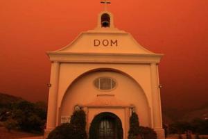 St. Vincent de Paul parish in Davenport, California, surrounded by an orange glow from an approaching fire. St. Vincent de Paul parish in Davenport, California, surrounded by an orange glow from an approaching fire.