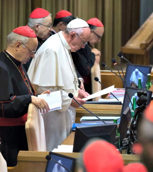 Pope Francis leads prayer inside the hall of the Synod of Bishops.
Pope Francis leads prayer inside the hall of the Synod of Bishops.
