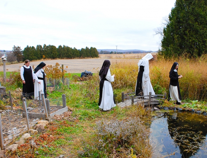 Valley of Our Lady Cistercian Monastery is attracting millennial vocations, offering peace and solitude for garden walks and processions with and adoration of the Blessed Sacrament and praying of the Divine Office in choir. Also shown: Sister Mary Bede prostrates during her solemn profession on Nov. 17, 2012. Saying the prayers of solemn consecration was the sisters' abbot at that time, Abbot Anselm of the Abbey of Mehrerau, in Austria, the head of the sisters' congregation. The sisters belong to a group of Swiss-Austrian-German monasteries. Valley of Our Lady Cistercian Monastery is attracting millennial vocations, offering peace and solitude for garden walks and processions with and adoration of the Blessed Sacrament and praying of the Divine Office in choir. Also shown: Sister Mary Bede prostrates during her solemn profession on Nov. 17, 2012. Saying the prayers of solemn consecration was the sisters' abbot at that time, Abbot Anselm of the Abbey of Mehrerau, in Austria, the head of the sisters' congregation. The sisters belong to a group of Swiss-Austrian-German monasteries.