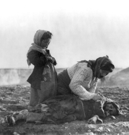 An Armenian woman kneels beside a dead child near the city of Aleppo, during the genocide carried out by the Ottoman Empire against Armenians that began in April 1915. An Armenian woman kneels beside a dead child near the city of Aleppo, during the genocide carried out by the Ottoman Empire against Armenians that began in April 1915.