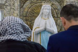 Iraqi Christians attend Christmas Eve Mass at the Syriac Catholic Church of the Immaculate Conception in the predominantly Iraqi Christian town of Qaraqosh, in Nineveh province some 30 kilometers (18.6 miles) from Mosul, on Dec. 24, 2019. The 2020 ‘World Watch List’ report found that 87% of Christians have left Iraq since 2003. Iraqi Christians attend Christmas Eve Mass at the Syriac Catholic Church of the Immaculate Conception in the predominantly Iraqi Christian town of Qaraqosh, in Nineveh province some 30 kilometers (18.6 miles) from Mosul, on Dec. 24, 2019. The 2020 ‘World Watch List’ report found that 87% of Christians have left Iraq since 2003.