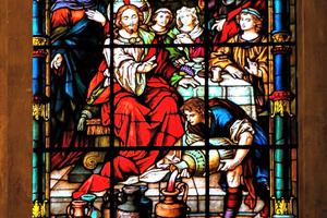 Detail of a stained-glass window from Malaga, Spain, depicting the wedding at Cana. Detail of a stained-glass window from Malaga, Spain, depicting the wedding at Cana.