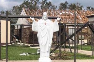 Statue of Jesus in front of damaged church property in the Diocese of Lake Charles. Statue of Jesus in front of damaged church property in the Diocese of Lake Charles.