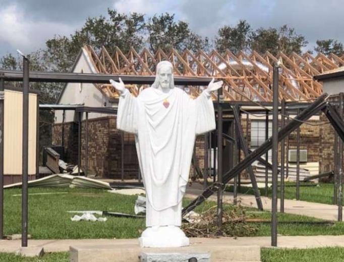 Statue of Jesus in front of damaged church property in the Diocese of Lake Charles. Statue of Jesus in front of damaged church property in the Diocese of Lake Charles.