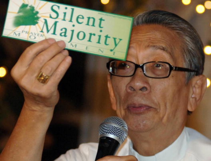 Philippine Archbishop Oscar Cruz shows a sticker during the launching of the "silent majority prayer movement" movement in a pressconference in Manila 26 January 2006 calling on the Catholic Filipinos to pray for the welfare of the country amid a political crisis surrounding President Gloria Arroyo's government . Philippine Archbishop Oscar Cruz shows a sticker during the launching of the "silent majority prayer movement" movement in a pressconference in Manila 26 January 2006 calling on the Catholic Filipinos to pray for the welfare of the country amid a political crisis surrounding President Gloria Arroyo's government .