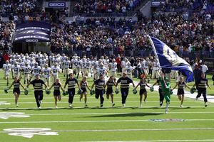 University of Notre Dame cheerleaders, coaches, and players take the field before the Navy game on Oct. 28, 2006. University of Notre Dame cheerleaders, coaches, and players take the field before the Navy game on Oct. 28, 2006.