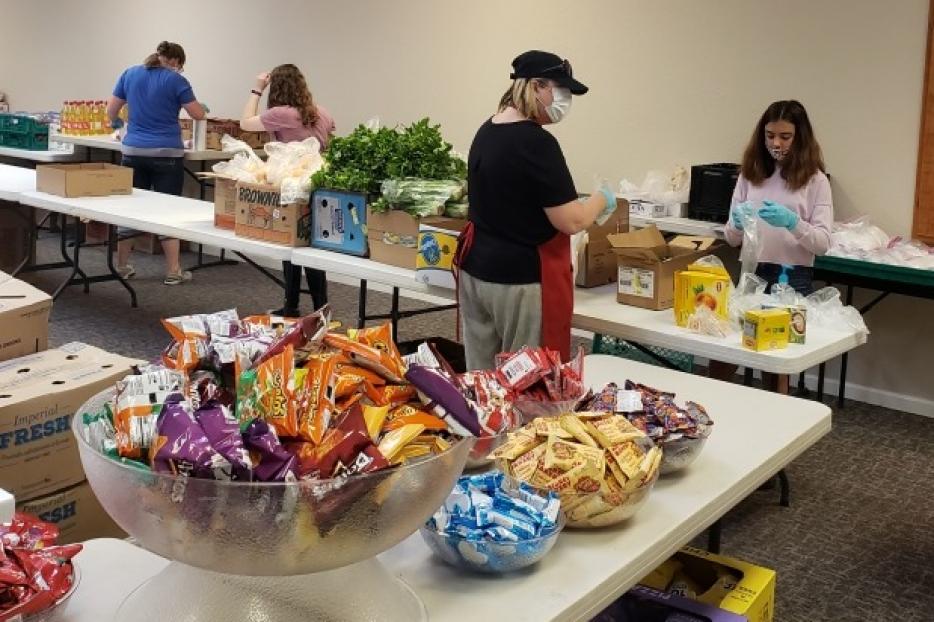 Volunteers and students prepare to open the Agape Food program at Kolbe Academy and Trinity Prep. Volunteers and students prepare to open the Agape Food program at Kolbe Academy and Trinity Prep.