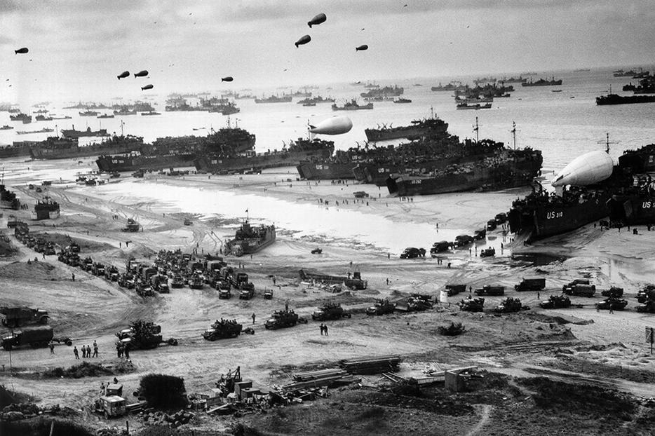 Landing ships putting cargo ashore on Omaha Beach, at low tide during the first days of the operation in June 1944. Landing ships putting cargo ashore on Omaha Beach, at low tide during the first days of the operation in June 1944.