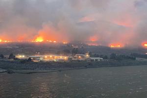 Flames spreading rapidly in Bridgeport, Washington. Raging fires along the West Coast are forcing families to evacuate with no return in sight. Flames spreading rapidly in Bridgeport, Washington. Raging fires along the West Coast are forcing families to evacuate with no return in sight.