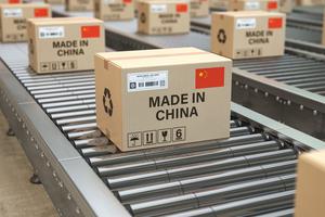 Cardboard boxes with text made in China and Chinese flag on the roller conveyor. U.S. government acted on Sept. 14, 2020 to withhold release of 5 categories of items from the Chinese province of Xinjiang and Anhui Cardboard boxes with text made in China and Chinese flag on the roller conveyor. U.S. government acted on Sept. 14, 2020 to withhold release of 5 categories of items from the Chinese province of Xinjiang and Anhui