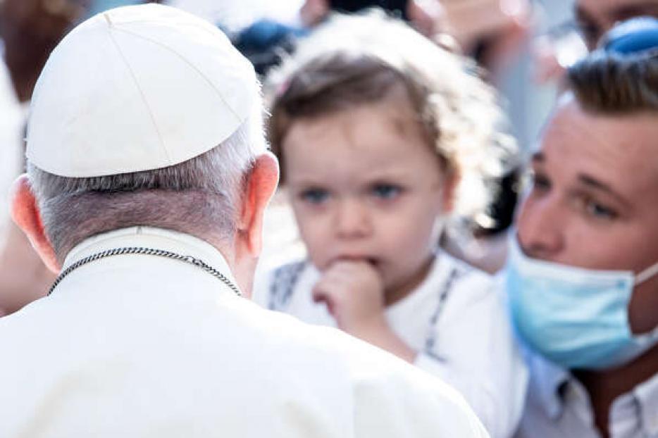 Pope Francis greets pilgrims including a father holding his small child on September 16, 2020. Pope Francis greets pilgrims including a father holding his small child on September 16, 2020.