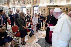 Pope Francis waves to a child at an audience with representatives of the Ambulatorium Sonnenschein in St. Pölten, Austria. Pope Francis waves to a child at an audience with representatives of the Ambulatorium Sonnenschein in St. Pölten, Austria.