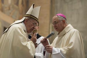 Pope Francis kisses a relic of Blessed Junipero Serra presented by Archbishop Jose H. Gomez of Los Angeles, California at the conclusion of Mass celebrated at the Pontifical North American College in Rome May 2, 2015. It was the first papal visit to the U.S. seminary since 1980. Saint Junipero Serra was an 18th century missionary who worked to defend the native people in America against the abuses of colonialism. Pope Francis kisses a relic of Blessed Junipero Serra presented by Archbishop Jose H. Gomez of Los Angeles, California at the conclusion of Mass celebrated at the Pontifical North American College in Rome May 2, 2015. It was the first papal visit to the U.S. seminary since 1980. Saint Junipero Serra was an 18th century missionary who worked to defend the native people in America against the abuses of colonialism.