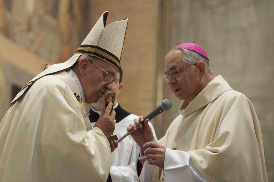 Pope Francis kisses a relic of Blessed Junipero Serra presented by Archbishop Jose H. Gomez of Los Angeles, California at the conclusion of Mass celebrated at the Pontifical North American College in Rome May 2, 2015. It was the first papal visit to the U.S. seminary since 1980. Saint Junipero Serra was an 18th century missionary who worked to defend the native people in America against the abuses of colonialism. Pope Francis kisses a relic of Blessed Junipero Serra presented by Archbishop Jose H. Gomez of Los Angeles, California at the conclusion of Mass celebrated at the Pontifical North American College in Rome May 2, 2015. It was the first papal visit to the U.S. seminary since 1980. Saint Junipero Serra was an 18th century missionary who worked to defend the native people in America against the abuses of colonialism.