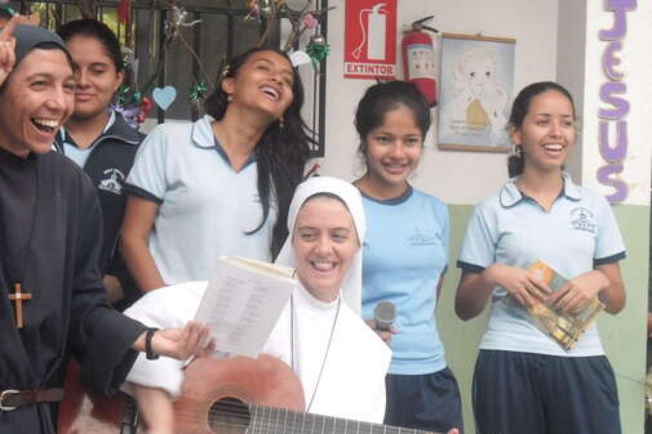 Sr. Clare Crockett plays music in Ecuador. Sr. Clare Crockett plays music in Ecuador.