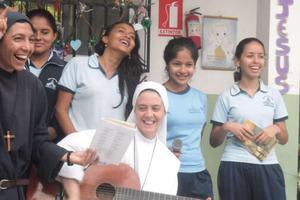 Sr. Clare Crockett plays music in Ecuador. Sr. Clare Crockett plays music in Ecuador.