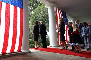 President Donald Trump Judge Amy Coney Barrett walk into the White House Rose Garden on Saturday with first lady Melania Trump and Barrett's family to present Barrett as his nominee to the Supreme Court. President Donald Trump Judge Amy Coney Barrett walk into the White House Rose Garden on Saturday with first lady Melania Trump and Barrett's family to present Barrett as his nominee to the Supreme Court.