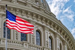 American flag flies in front of the United States Capitol building in Washington, D.C. American flag flies in front of the United States Capitol building in Washington, D.C.