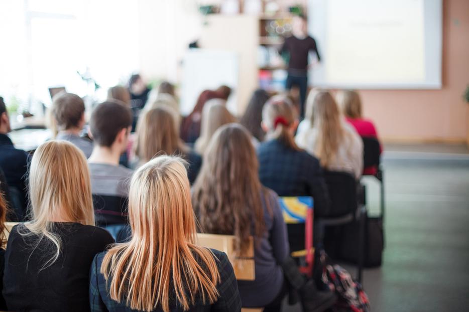 Students attending class. Students attending class.