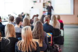 Students attending class. Students attending class.