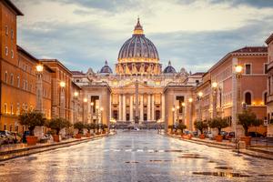 St. Peter's Basilica in the evening from Via della Conciliazione in Rome. St. Peter's Basilica in the evening from Via della Conciliazione in Rome.