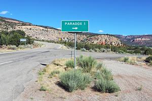 A road sign for Paradox, Colorado