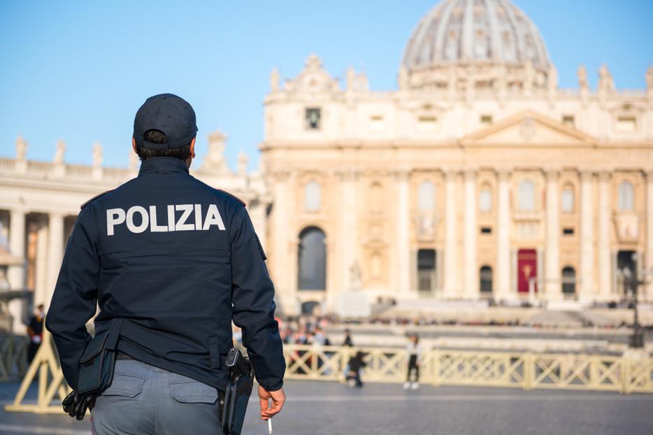 Police officer on duty at St Peter's square in Vatican City. Police officer on duty at St Peter's square in Vatican City.