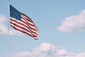 U.S. flag waves in the wind. Election Day 2020 draws near. U.S. flag waves in the wind. Election Day 2020 draws near.