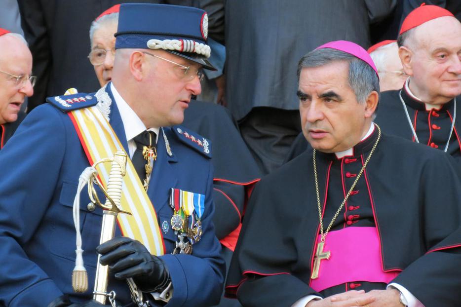 Gendarme Captain Domenico Giani and Msgr. Angelo Becciu, substitute for General Affairs to the Secretary of State, attend the Gendarme parade for the feast of St. Michael the Archangel, their patron, on October 5, 2012. Gendarme Captain Domenico Giani and Msgr. Angelo Becciu, substitute for General Affairs to the Secretary of State, attend the Gendarme parade for the feast of St. Michael the Archangel, their patron, on October 5, 2012.