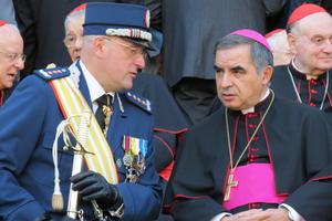 Gendarme Captain Domenico Giani and Msgr. Angelo Becciu, substitute for General Affairs to the Secretary of State, attend the Gendarme parade for the feast of St. Michael the Archangel, their patron, on October 5, 2012. Gendarme Captain Domenico Giani and Msgr. Angelo Becciu, substitute for General Affairs to the Secretary of State, attend the Gendarme parade for the feast of St. Michael the Archangel, their patron, on October 5, 2012.
