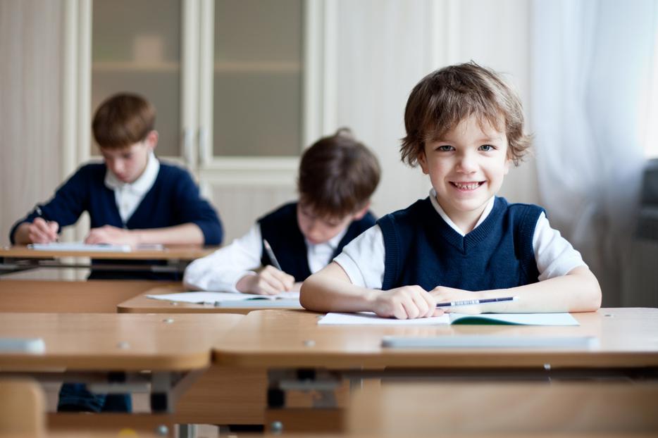 Students sit in class at a Catholic school. Students sit in class at a Catholic school.