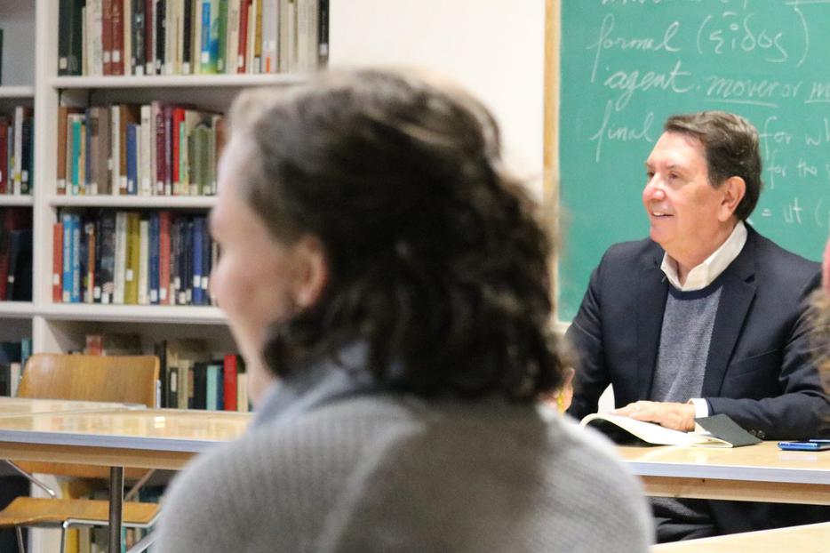 The seminar Robert Royal is teaching this semester is timely, discussing apocalyptic novels in light of current events. Junior Bridget Ruffing listens in the foreground. The seminar Robert Royal is teaching this semester is timely, discussing apocalyptic novels in light of current events. Junior Bridget Ruffing listens in the foreground.
