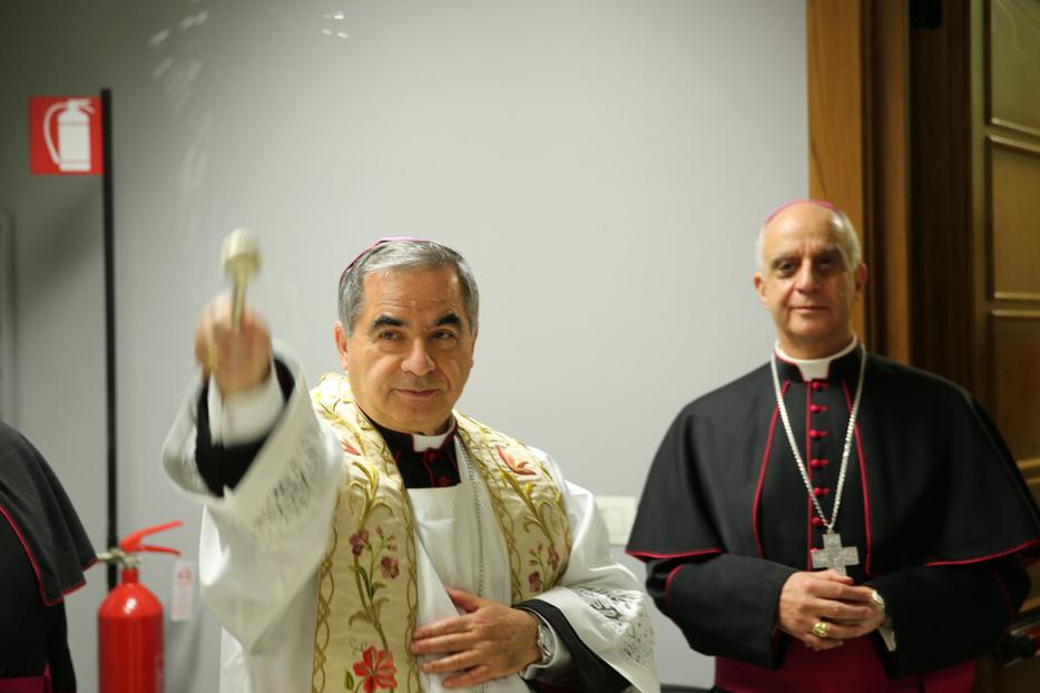 Cardinal Angelo Becciu and Mons. Fisichella at the Blessing and Inauguration of the Media Center and Pilgrimage Information Center for the Extraordinary Jubilee of Mercy on December 1, 2015. Cardinal Angelo Becciu and Mons. Fisichella at the Blessing and Inauguration of the Media Center and Pilgrimage Information Center for the Extraordinary Jubilee of Mercy on December 1, 2015.