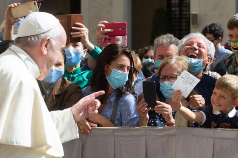 Pope Francis waves to pilgrims wearing masks during his General Audience on Sept. 22, 2020. Pope Francis waves to pilgrims wearing masks during his General Audience on Sept. 22, 2020.
