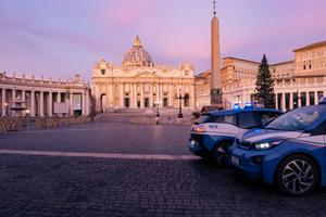 Police cars in front of St. Peters Basilica in Vatican City. Police cars in front of St. Peters Basilica in Vatican City.