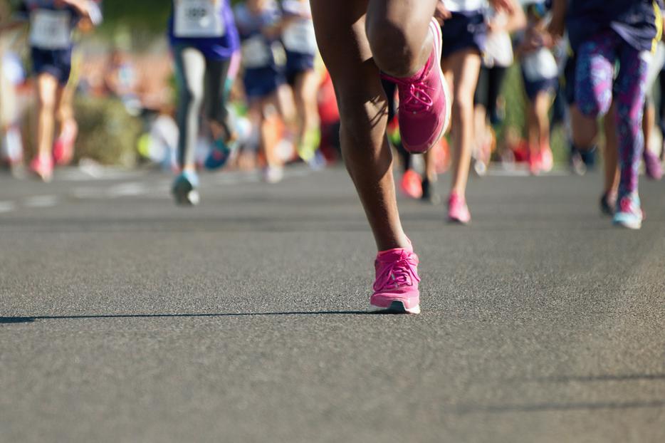 Girls running together in a race. Girls running together in a race.