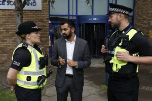 Humza Yousef, Scottish Justice Secretary, speaks with police officers, August 2018. Humza Yousef, Scottish Justice Secretary, speaks with police officers, August 2018.