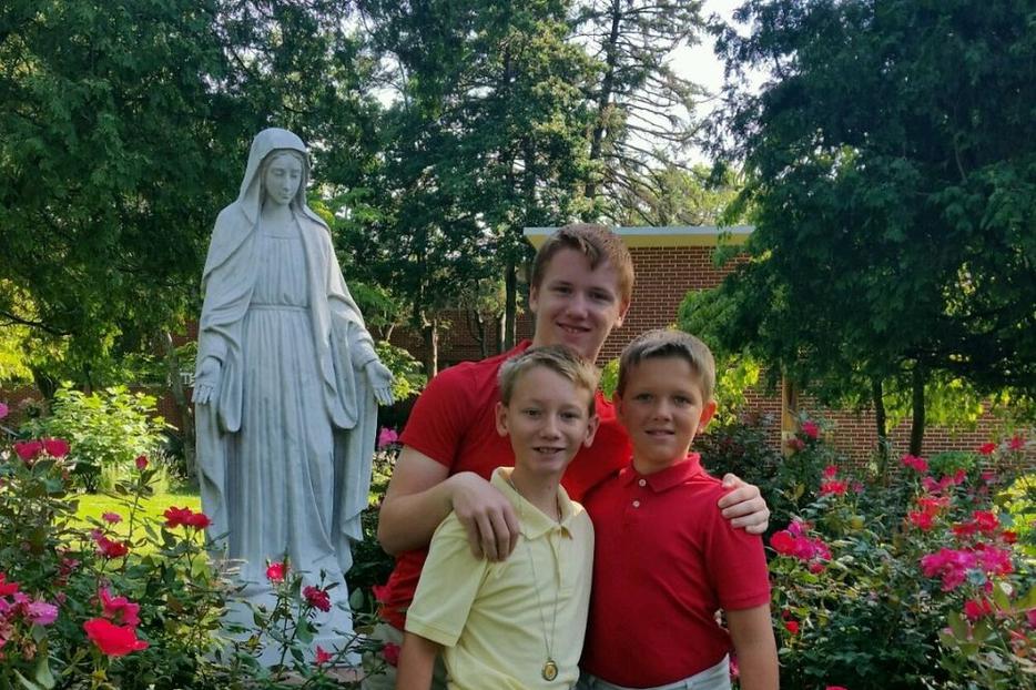 Left to right are Patrick (yellow shirt), Brendan (middle), and Sean Lacey. The picture was taken in July 2017 in the Rose garden at the family parish, St. Rose of Lima, after the healings. Patrick is now 14, Brendan is 16, and Sean is 13. Left to right are Patrick (yellow shirt), Brendan (middle), and Sean Lacey. The picture was taken in July 2017 in the Rose garden at the family parish, St. Rose of Lima, after the healings. Patrick is now 14, Brendan is 16, and Sean is 13.