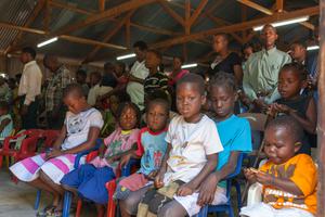 Children sit during a Sunday church service in Mozambique. Children sit during a Sunday church service in Mozambique.