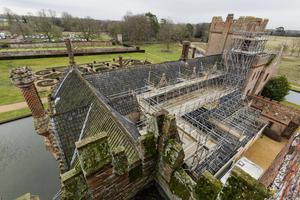 Oxburgh Hall is covered in scaffolding during building work to replace the roof of the moated manor house. Catholic artifacts have been discovered through the process. Oxburgh Hall is covered in scaffolding during building work to replace the roof of the moated manor house. Catholic artifacts have been discovered through the process.