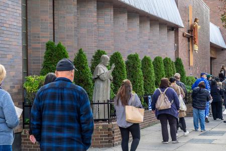 People wait in line Oct. 27 to vote as part of early general voting at St. Dominic Catholic Church in Brooklyn, New York.