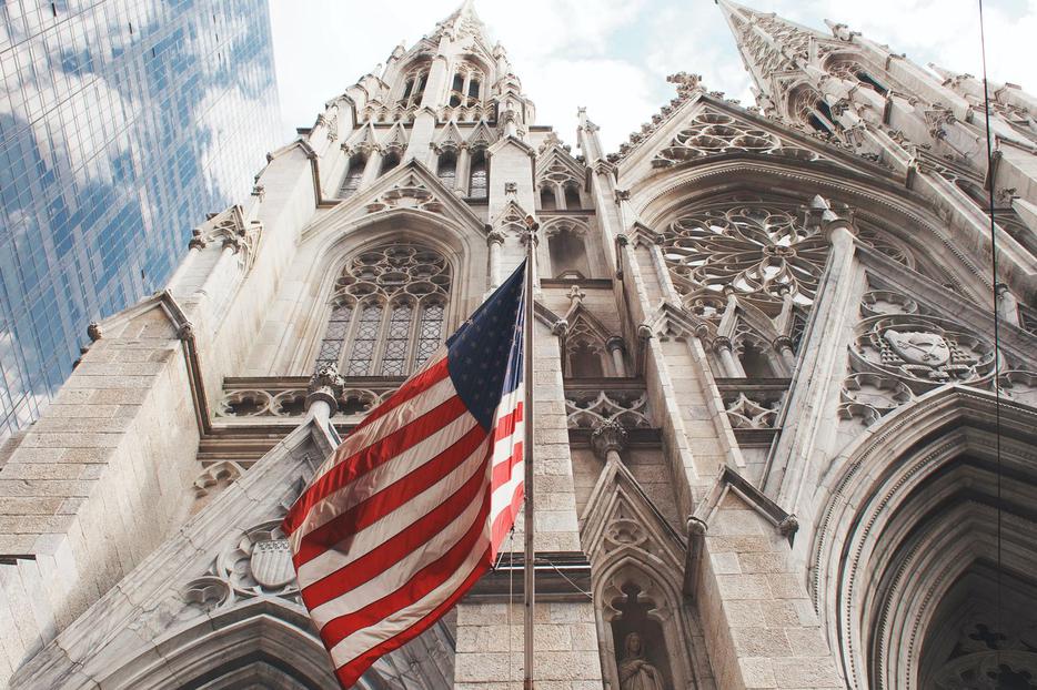 An American flag waves outside of St. Patrick's Cathedral in Manhattan. An American flag waves outside of St. Patrick's Cathedral in Manhattan.