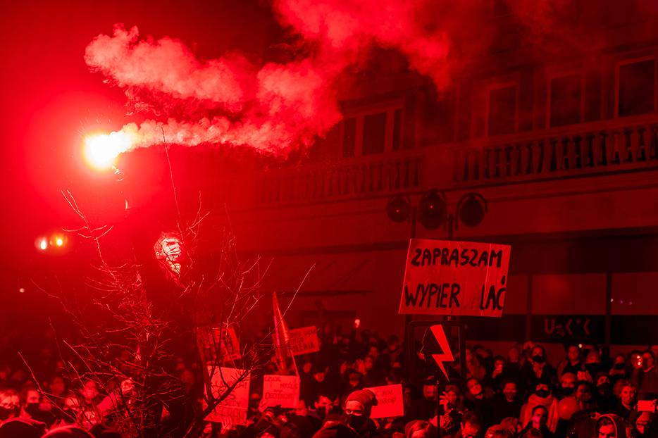 A demonstrator lights a flare as he takes part in a pro-abortion protest in central Warsaw on Nov. 18. A demonstrator lights a flare as he takes part in a pro-abortion protest in central Warsaw on Nov. 18.